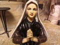 Close-up on a statue of the virgin mary praying, inside a cathedral Royalty Free Stock Photo