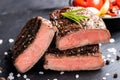 Close-up of steak Top Blade roasting medium ready to eat on dark stone background Royalty Free Stock Photo