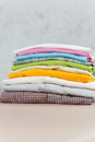 Close up steam iron colorful clothes washed laundry on white background. Housekeeping. Copy space advertisement. Place for text. Royalty Free Stock Photo