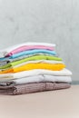 Close up steam iron colorful clothes washed laundry on white background. Housekeeping. Copy space advertisement. Place for text. Royalty Free Stock Photo