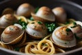 Close-up of steamed clams, linguini and parsley served in casserole