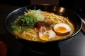 close-up of steaming bowl of rich and flavourful ramen, with swirls of creamy broth Royalty Free Stock Photo