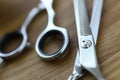 Close-up, steel barber scissors are lying on table Royalty Free Stock Photo