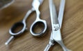 Close-up, steel barber scissors are lying on table Royalty Free Stock Photo