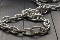 Close-up of a steel chain perspective receding into the distance Royalty Free Stock Photo