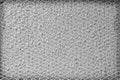 Steel mesh texture in seamless shaped patterns on cement wall rough grey old background Royalty Free Stock Photo