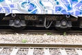 Close up of steel train wheel on rail track Royalty Free Stock Photo