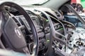 Close-up of the steering wheel of a car after an accident. The driver`s airbags did not deploy. Soft focus. Broken windshield wit