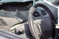 Close-up of the steering wheel of a car after an accident. The driver\'s airbags did not deploy. Soft focus.