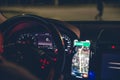 Close-up, steering wheel and navigator in a car at night. Royalty Free Stock Photo