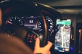 Close-up, steering wheel and navigator in a car at night. Royalty Free Stock Photo