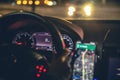 Close-up, steering wheel and navigator in a car at night. Royalty Free Stock Photo
