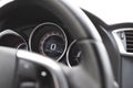 Close-up of the steering wheel and speedometer inside the car