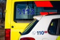 Close up of stencilled police and ambulance cars, 112 and 113 emergency services concept