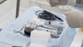 Close up of sterile surgical tools for laparoscopic surgery. Action. Tools for medical surgery with the glass bowl of Royalty Free Stock Photo