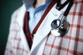 Close-up of a stethoscope in the hands of a doctor, Closeup of a stethoscope on a medical uniform, AI Generated