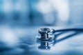 Close-up of a stethoscope on a reflective surface in a medical setting Royalty Free Stock Photo