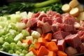 close-up of stew ingredients: chopped vegetables and meat