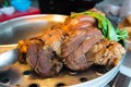 Close up stewed pork leg on stainless steel pot Royalty Free Stock Photo