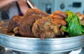 Close up stewed pork leg on stainless steel pot Royalty Free Stock Photo