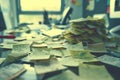 Closeup of sticky notes with halffinished writing lying in disarray on a desk Blur the office and computer screen behind them Royalty Free Stock Photo