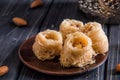 Close up. Still life. Baklava bird`s nest. Turkish honey sweets. Dark wooden background