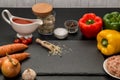 Close up. Cooking dinner at home. Ingredients for roasting stuffed bell peppers. Black background