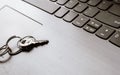 Close up of Still life of Key Ring on laptop computer keyboard. Conceptual image shown as network security key. Cyber Security,