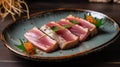 Japanese cuisine. Seared tuna on a ceramic plate Royalty Free Stock Photo