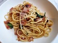 Stir-fried pasta linguine with dried chili and crispy bacon Royalty Free Stock Photo