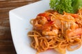 Close up stir fried spaghetti and prawn with tomato sauce. Royalty Free Stock Photo