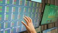 Close up of stock market trader hand on monitors