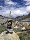 Close up stone balance with mountain landscape.