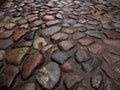 Close up of a stone cobblestone pavement wet after rain Royalty Free Stock Photo