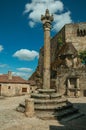 Close-up of stone pillory and gothic house on square Royalty Free Stock Photo