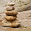 Close-up of stone stack on sandy beach