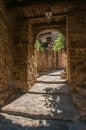 Close-up of stone staircase and arch in an alleyway at Les Arcs-sur-Argens Royalty Free Stock Photo