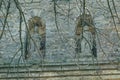 Close-up stone wall of the church with statues. Religious background. Passion, suffering concept