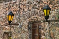 Close-up of a stone wall with street lamps in historic quarter o