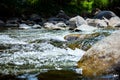 Close-up of stone with water rapids on the river Royalty Free Stock Photo