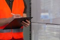 Close-up of a storekeeper signing document Royalty Free Stock Photo