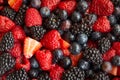 Close up of Strawberries, blackberries, raspberries, blueberries mixed together with sugar Royalty Free Stock Photo