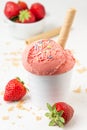 Close-up of strawberry ice cream in white bowl with waffle cone on white table with strawberries Royalty Free Stock Photo