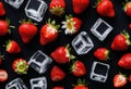 A close-up of a strawberry with ice cubes on a black background Royalty Free Stock Photo