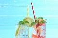 Close up strawberry juice and lemon juice mixing soda no alcohol in the glass garnish with mint leaves, sliced lemon on blue Royalty Free Stock Photo