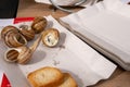 Close up street fast food take away portion of cooked escargot snails with French herbs and garlic butter and baguette bread. Copy Royalty Free Stock Photo