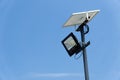 Close up street or garden lamp post with solar cell panel energy against blue sky background Royalty Free Stock Photo