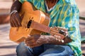 Close up of a street musician playing a guitar in Trinidad Cuba