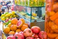 Close up street selling vendor of freshly sqeezed juices, smoothies and fruit salads on market place in Tel Aviv, Israel. Selectiv