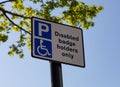 Close up of street sign indicating parking for disabled badge holders only Widnes April 2019